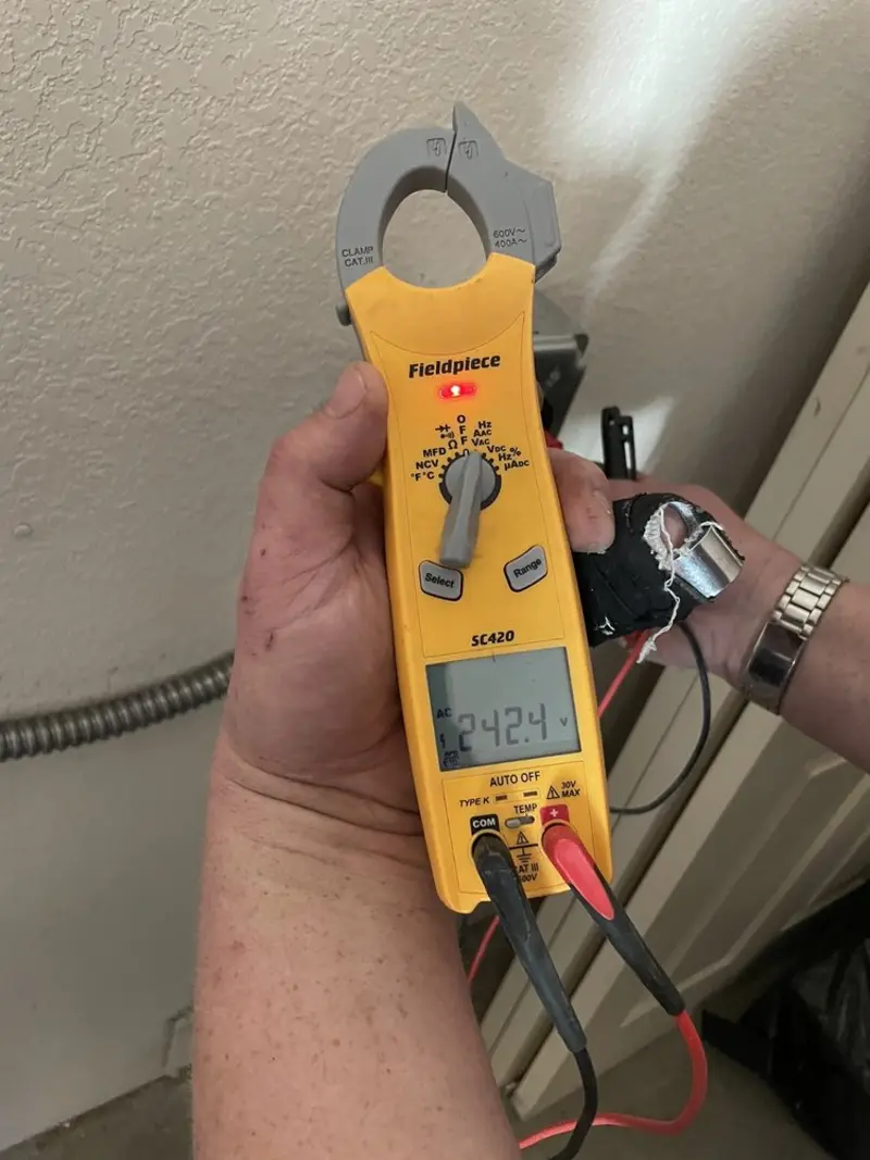 Voltage testing with clamp meter during Electrical Installation Services in Elizabethton